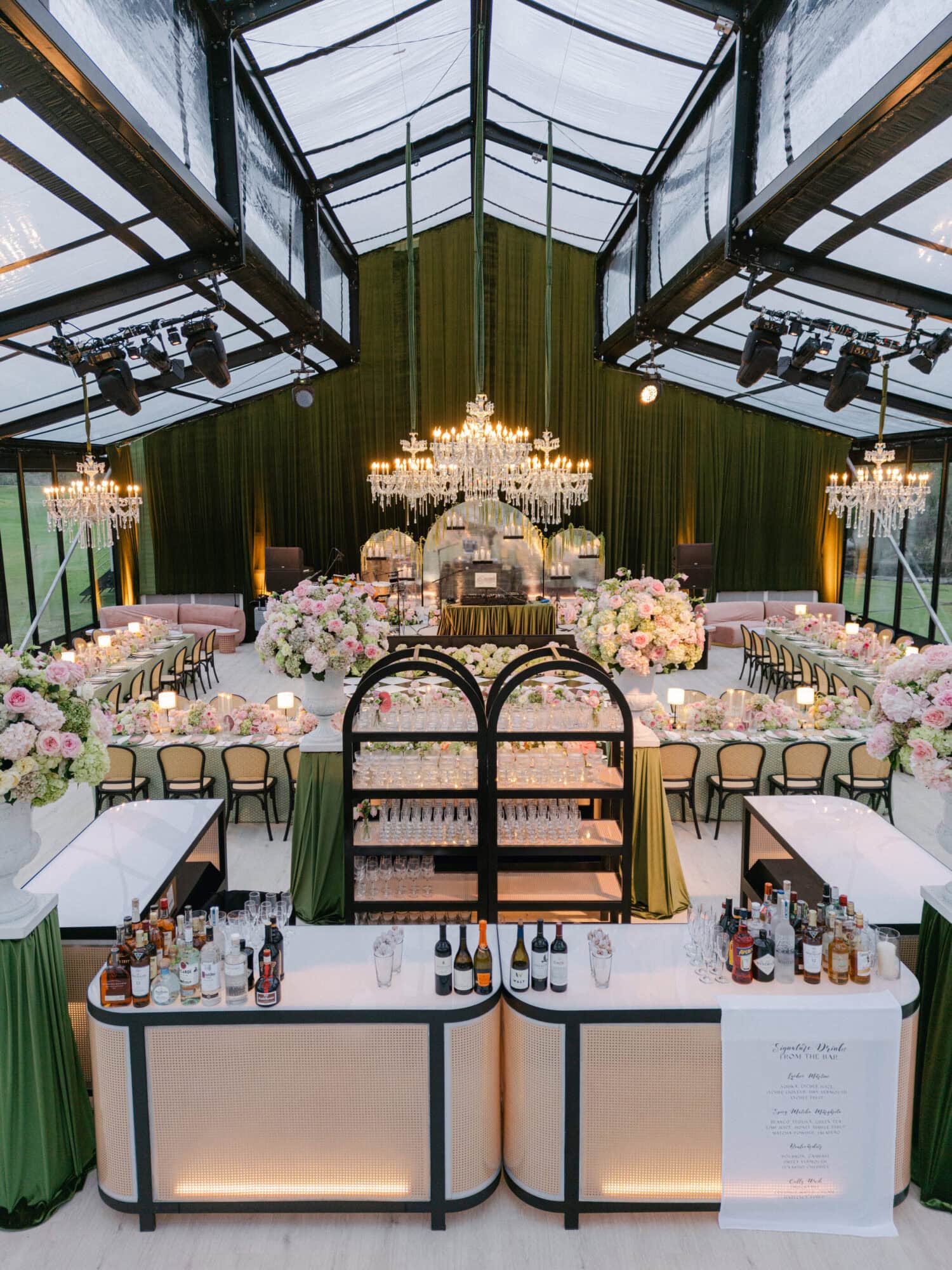 Luxury wedding reception in a clear-top tent designed and planned by Table 6 Productions